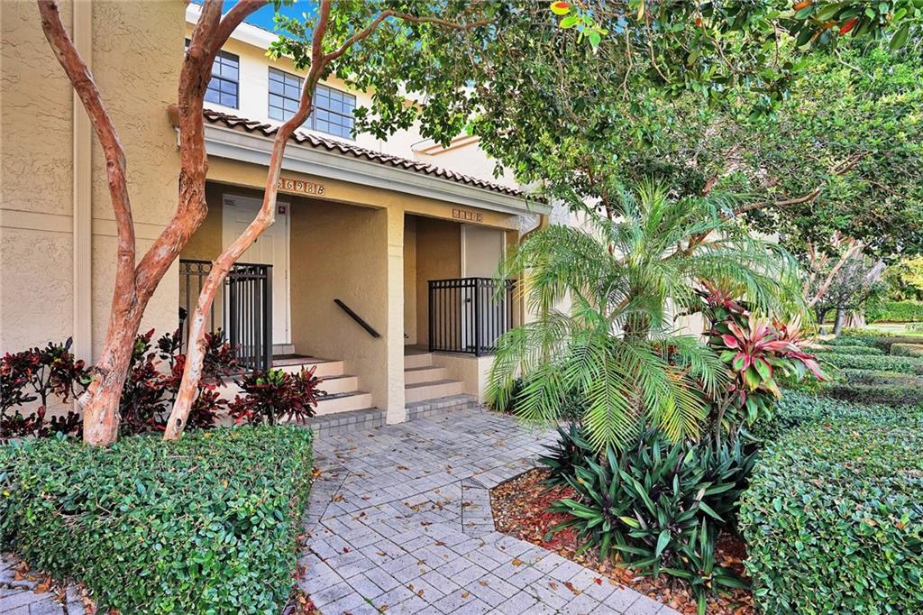 6698 Montego Bay Boulevard, Unit D Boca Raton, FL 33433 - Photo 30 of 44 a front view of a house with garden