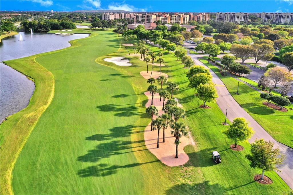 6698 Montego Bay Boulevard, Unit D Boca Raton, FL 33433 - Photo 40 of 44 a view of a swimming pool with a yard