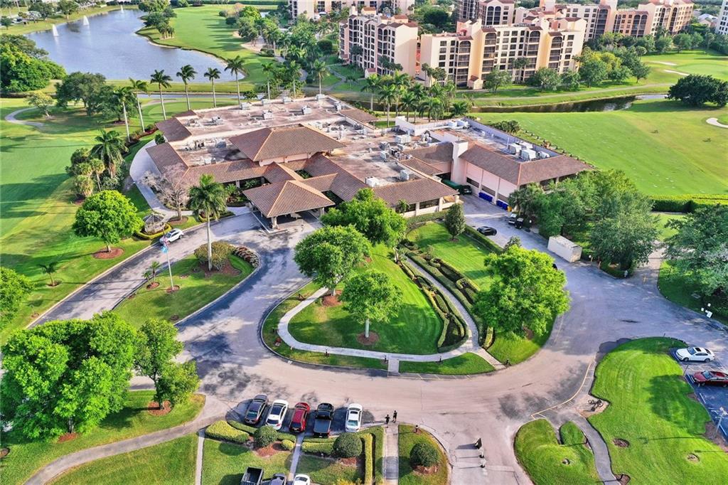 6698 Montego Bay Boulevard, Unit D Boca Raton, FL 33433 - Photo 44 of 44 an aerial view of a house with a garden and lake view