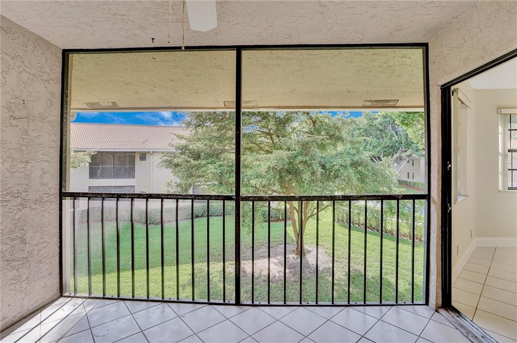6698 Montego Bay Boulevard, Unit D Boca Raton, FL 33433 - Photo 7 of 44 a view of a large window with an outdoor space