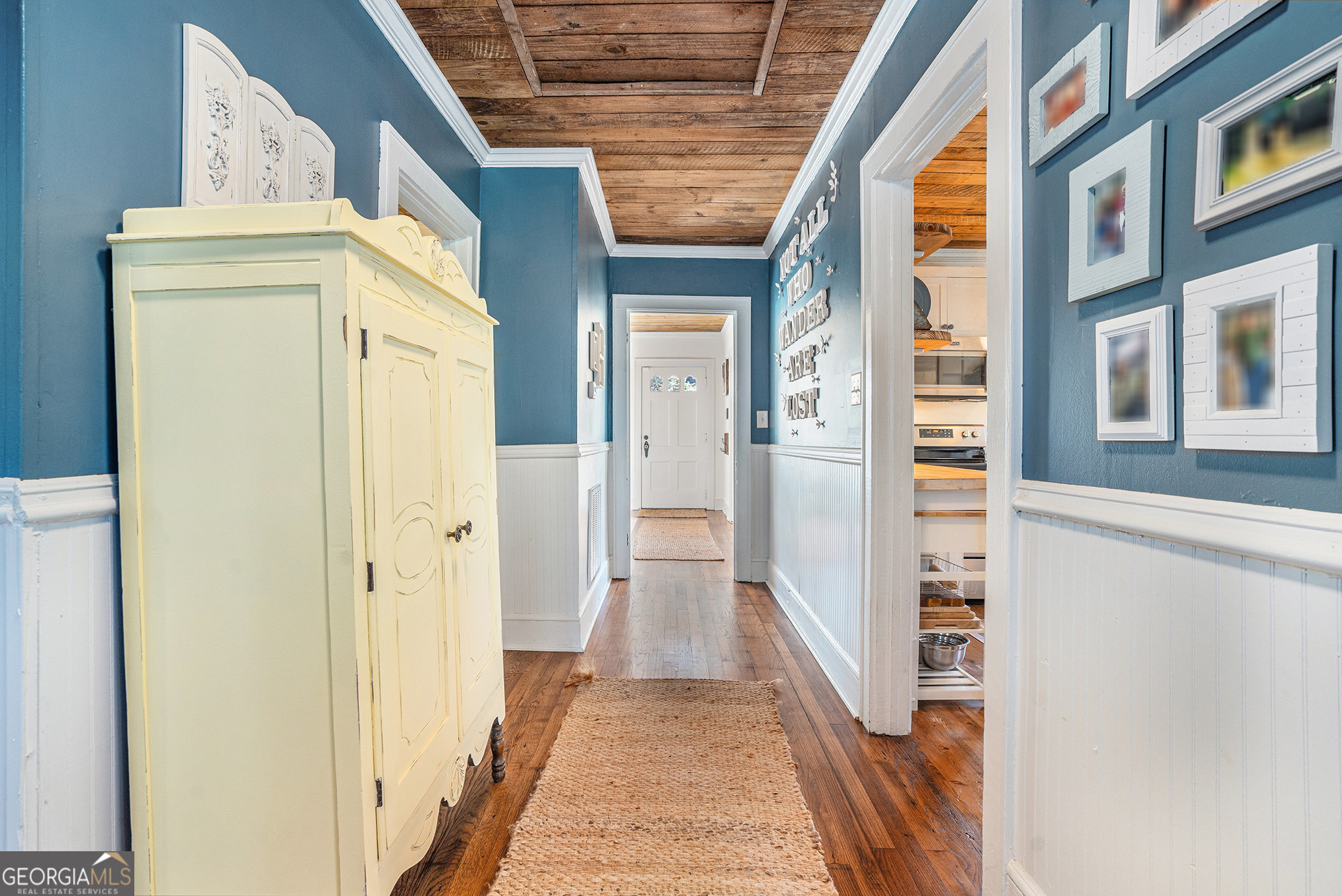 17 West Wright Street Winder, GA 30680 - Photo 16 of 31 a view of a hallway with wooden floor and staircase