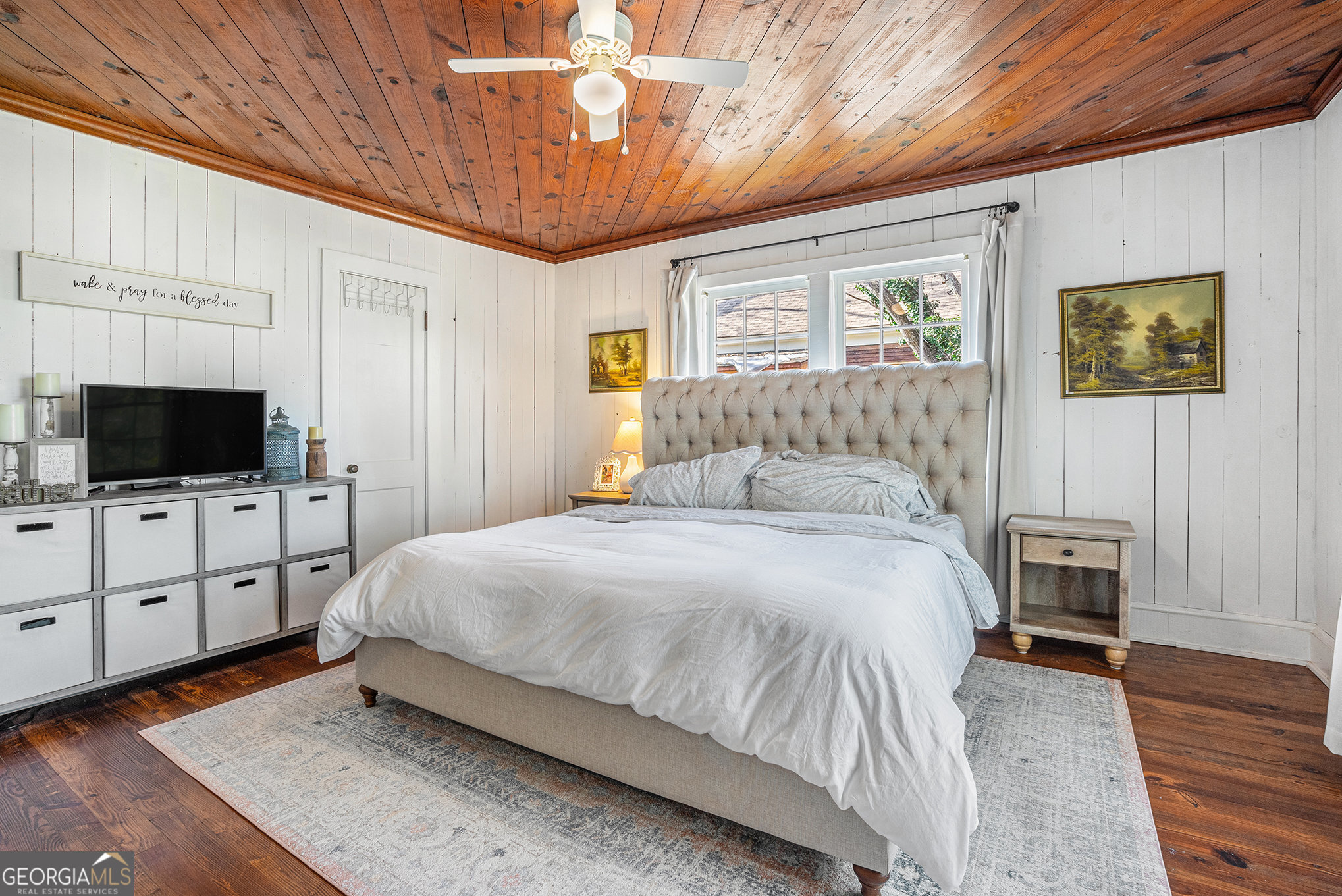 17 West Wright Street Winder, GA 30680 - Photo 18 of 31 a spacious bedroom with a bed and a flat screen tv