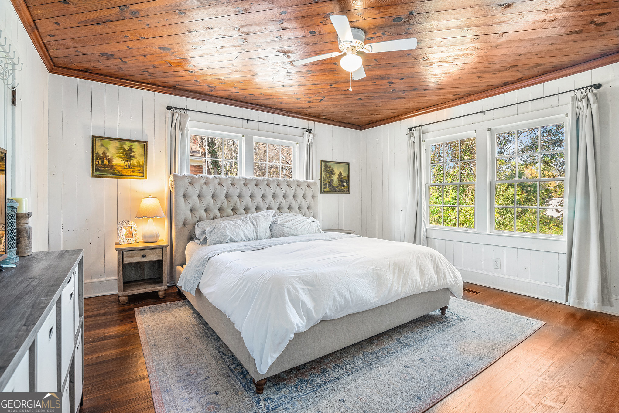 17 West Wright Street Winder, GA 30680 - Photo 24 of 31 a bedroom with a large bed and wooden floor