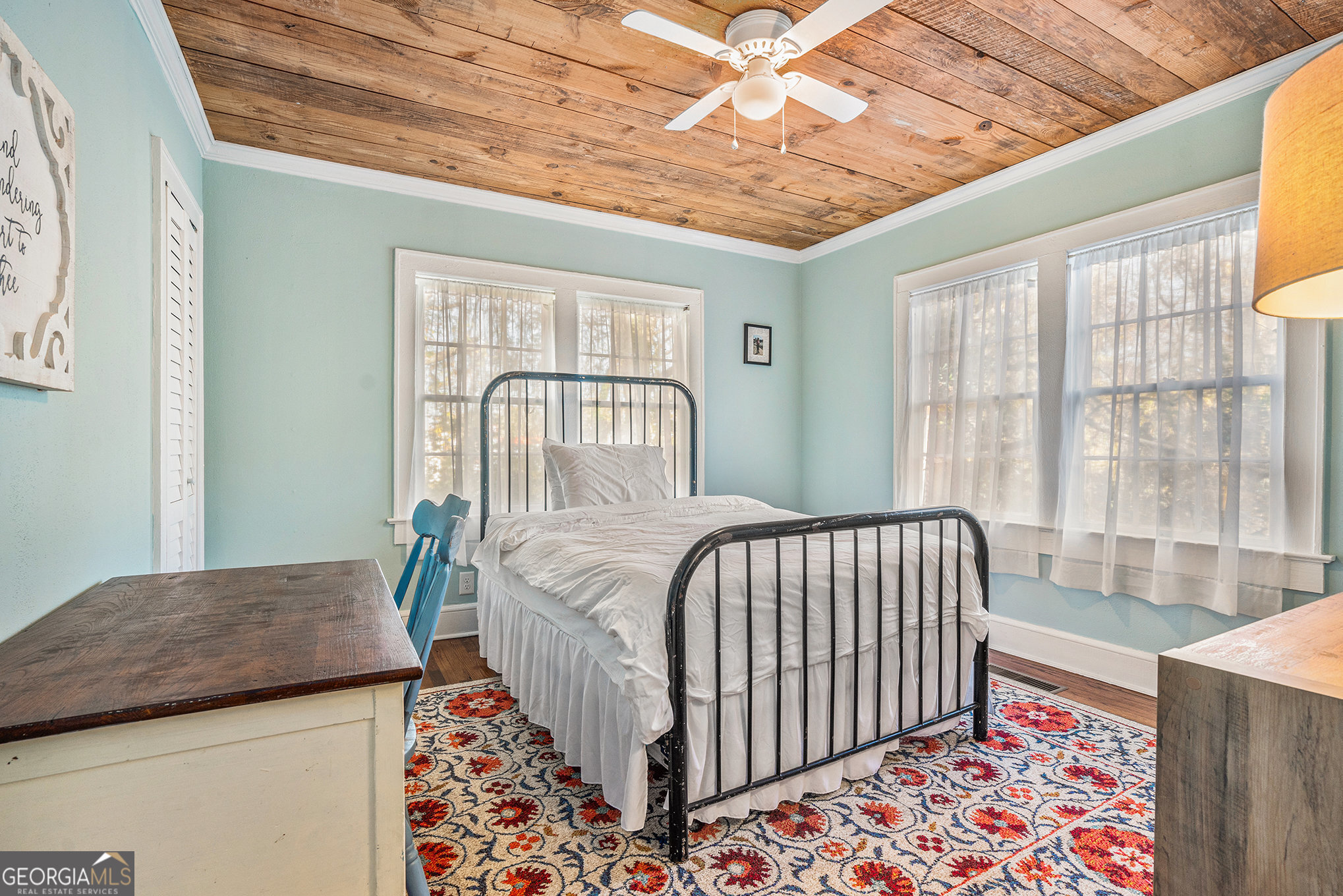 17 West Wright Street Winder, GA 30680 - Photo 25 of 31 a bedroom with a bed and wooden floor