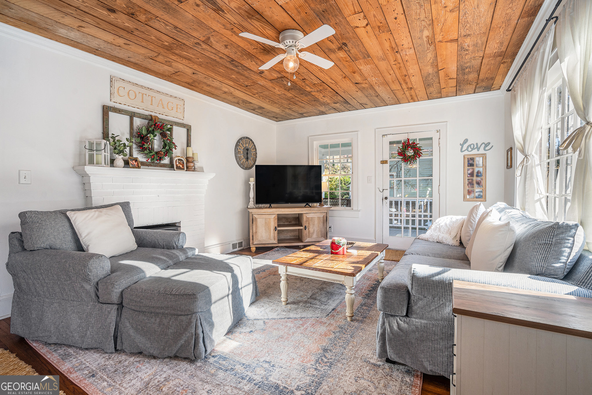 17 West Wright Street Winder, GA 30680 - Photo 6 of 31 a living room with furniture and a flat screen tv
