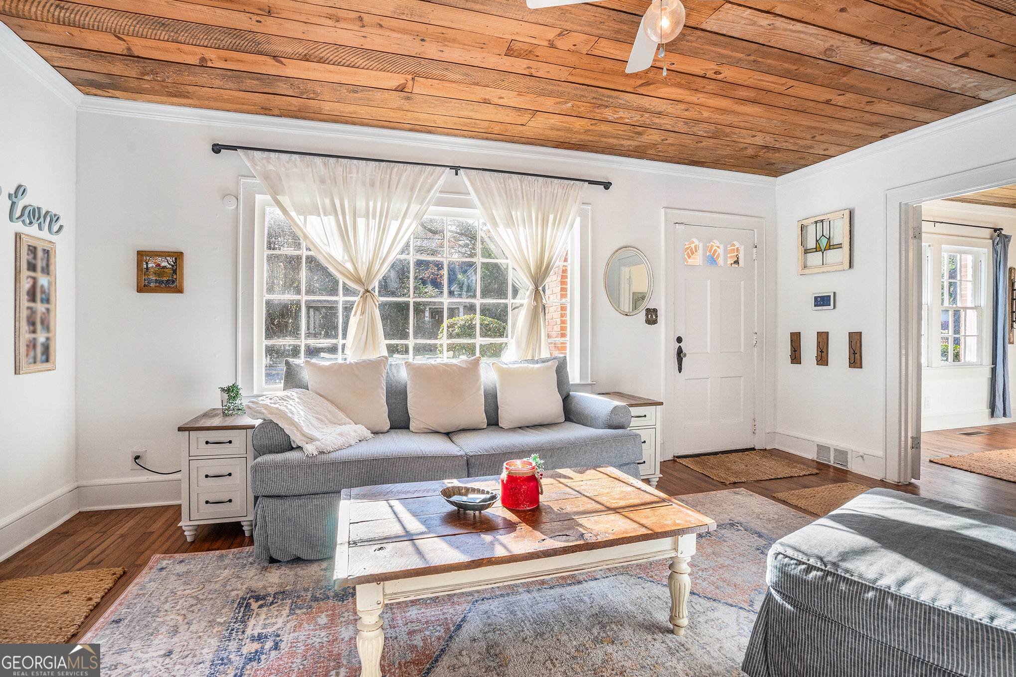 17 West Wright Street Winder, GA 30680 - Photo 8 of 31 a living room with furniture and a large window