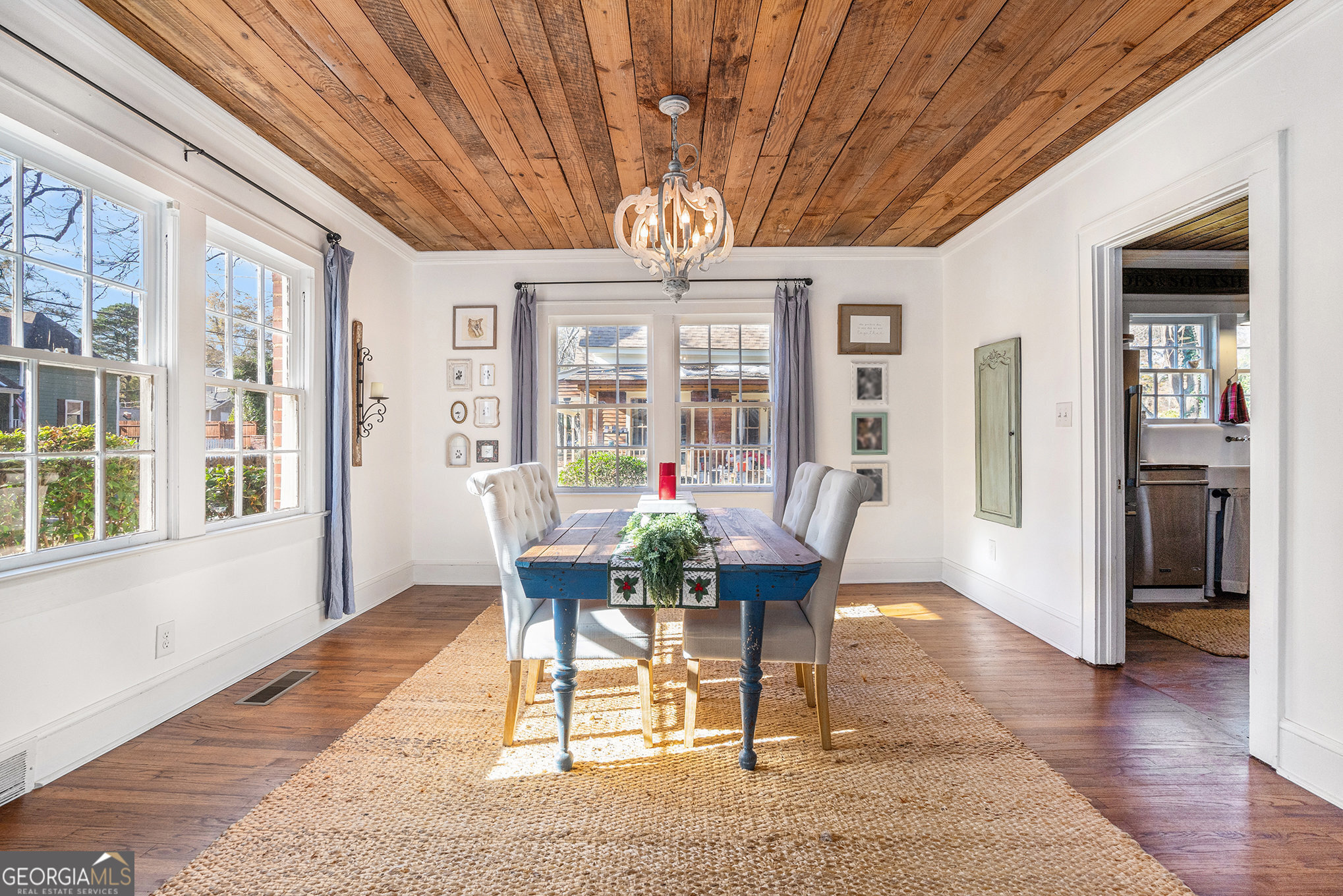 17 West Wright Street Winder, GA 30680 - Photo 9 of 31 a view of a dining room with furniture wooden floor and chandelier