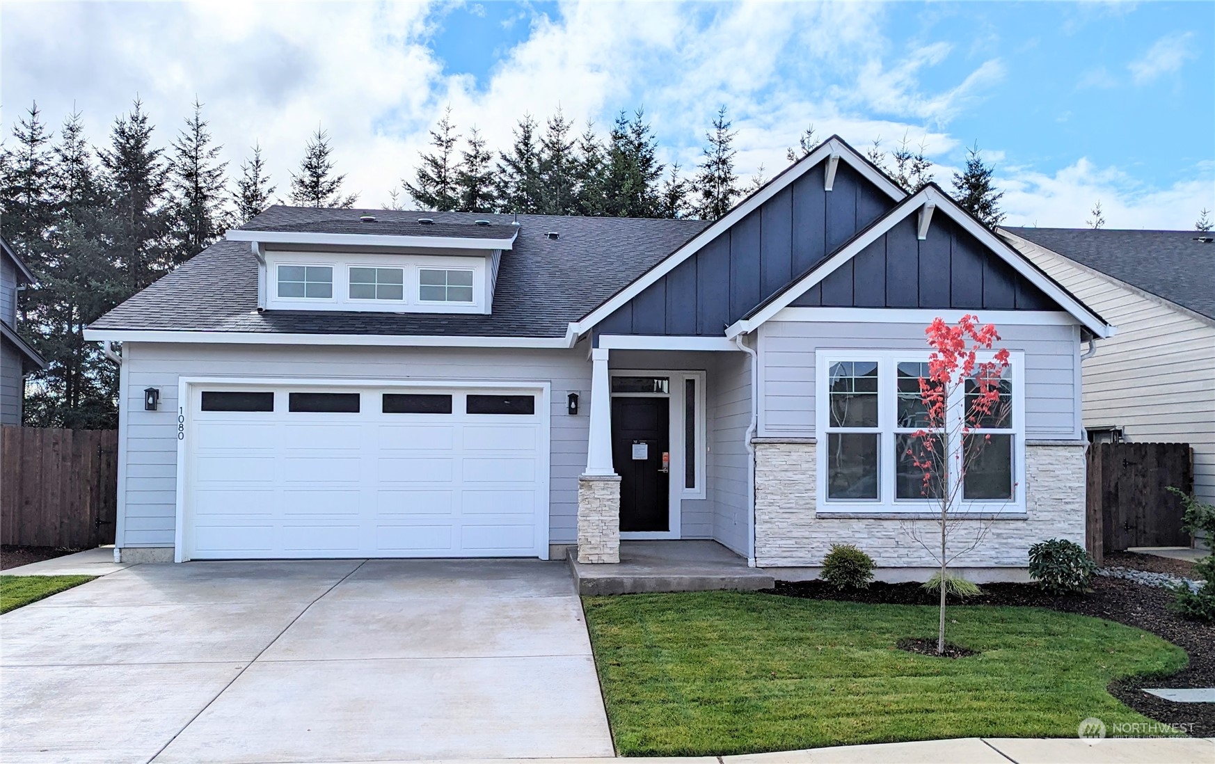 1080 Rw Fletcher Street Winlock, WA 98596 - Photo 1 of 27 a front view of a house with a yard