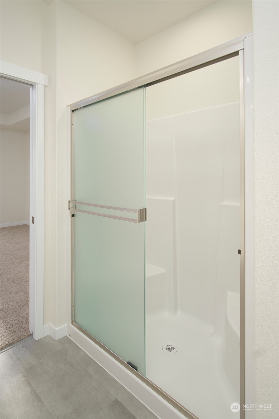 1080 Rw Fletcher Street Winlock, WA 98596 - Photo 15 of 27 a bathroom with a glass shower door