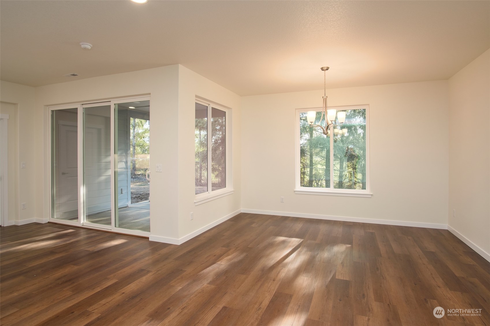 1080 Rw Fletcher Street Winlock, WA 98596 - Photo 20 of 27 an empty room with wooden floor and windows