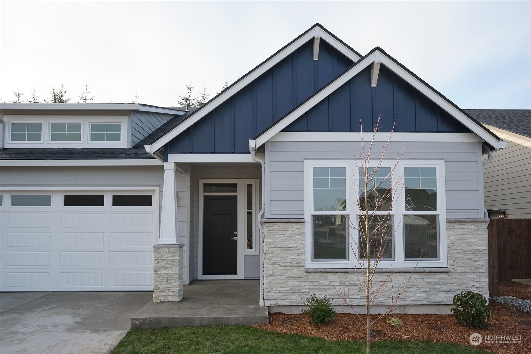 1080 Rw Fletcher Street Winlock, WA 98596 - Photo 2 of 27 a front view of a house with a yard