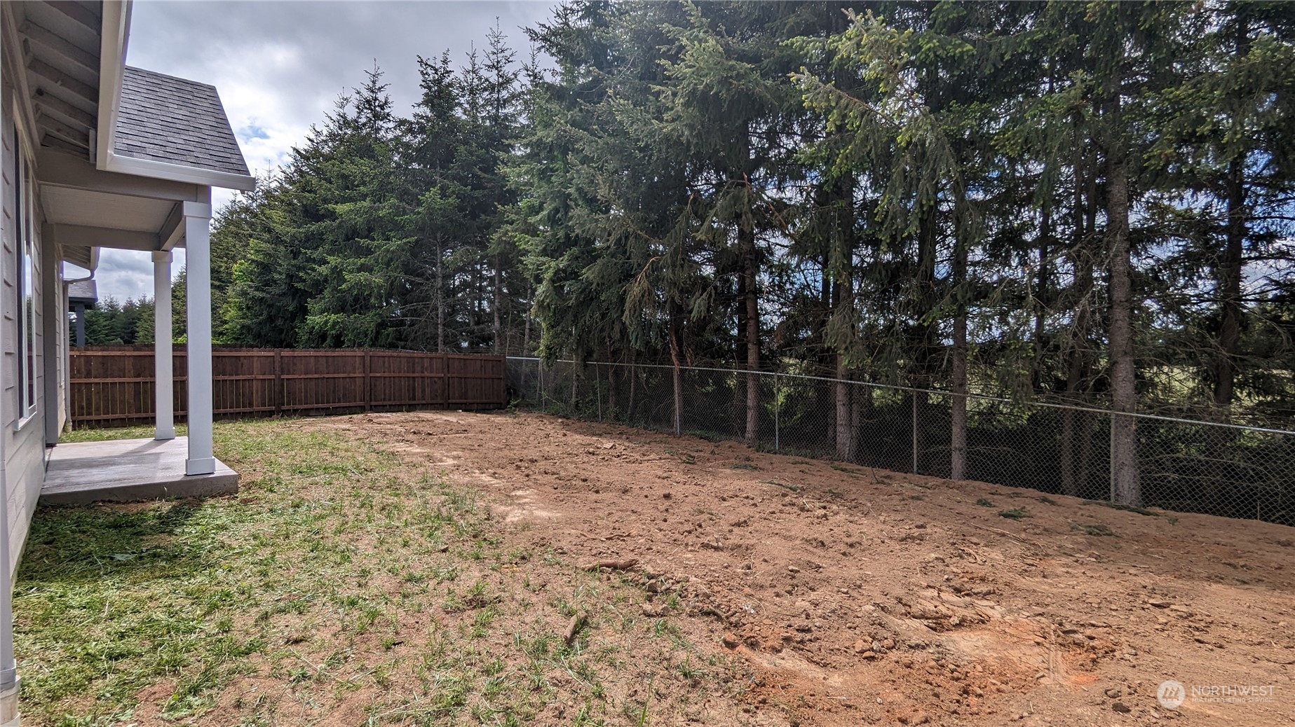 1080 Rw Fletcher Street Winlock, WA 98596 - Photo 26 of 27 a backyard of a house with lots of green space
