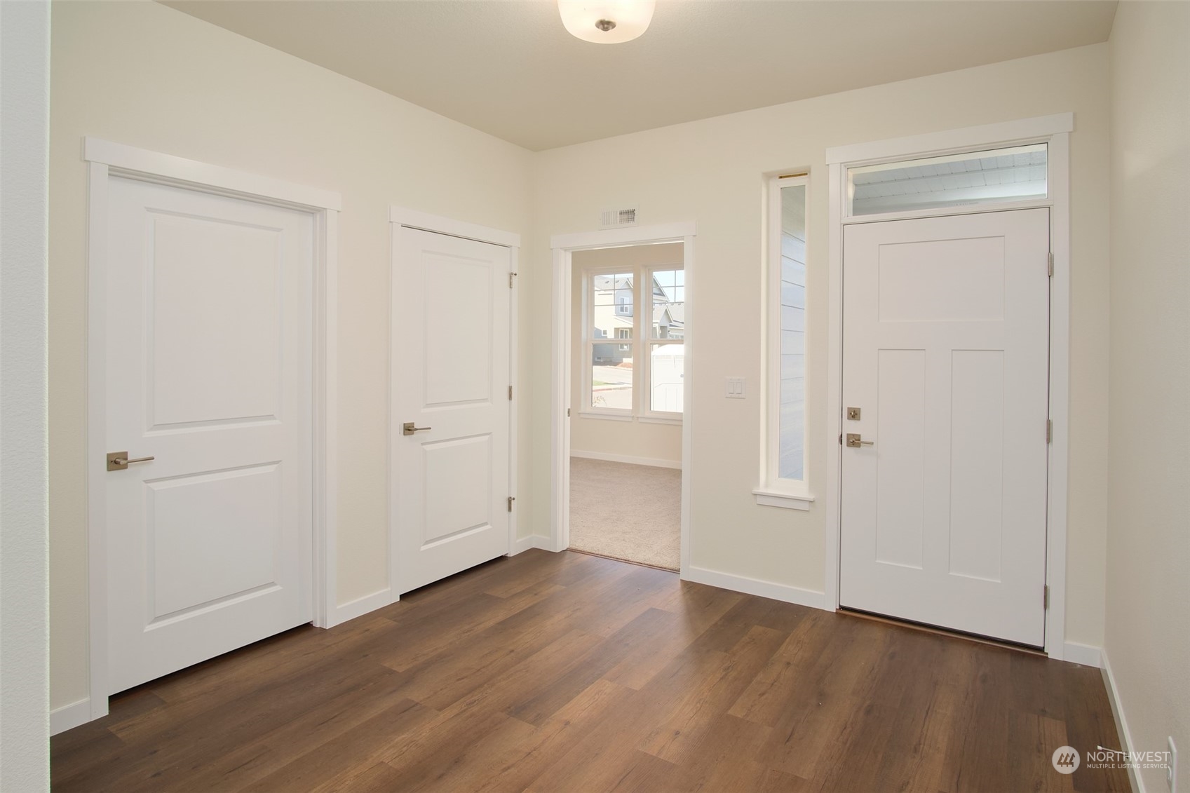1080 Rw Fletcher Street Winlock, WA 98596 - Photo 10 of 27 a view of an empty room with wooden floor