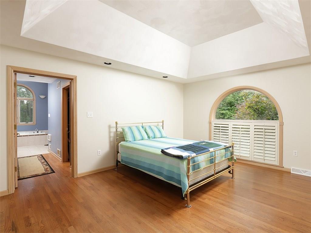 224 West Road Ligonier, PA 15658 - Photo 16 of 25 Tray ceiling in the master bedroom with those beautiful oak floors! Plantation shutters too!