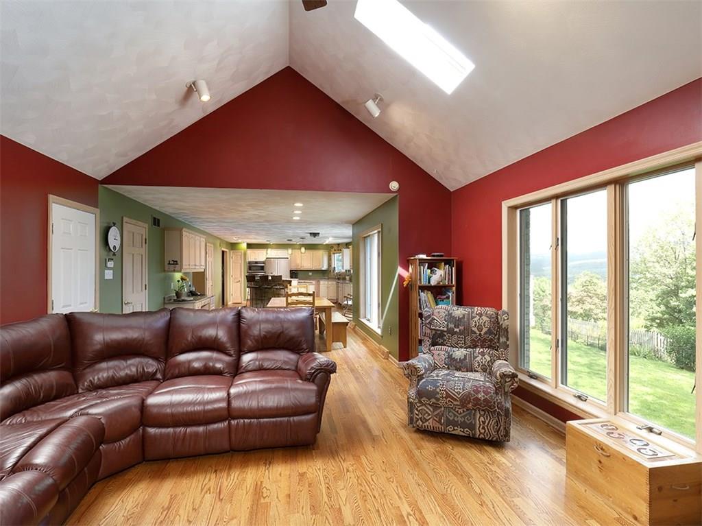 224 West Road Ligonier, PA 15658 - Photo 3 of 25 Just look at this room from the fireplace! The gleaming oak floors run throughout the first floor of the home including the dining room and office too!