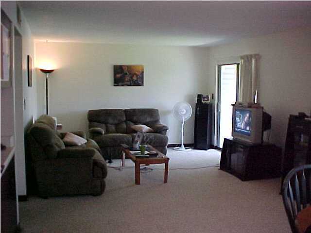101 Old Ferry Road, Unit 18C Shalimar, FL 32579 - Photo 5 of 9 a living room with furniture and a flat screen tv