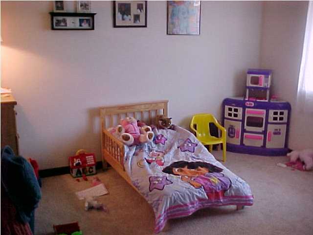 101 Old Ferry Road, Unit 18C Shalimar, FL 32579 - Photo 8 of 9 a bedroom with a bed and dresser