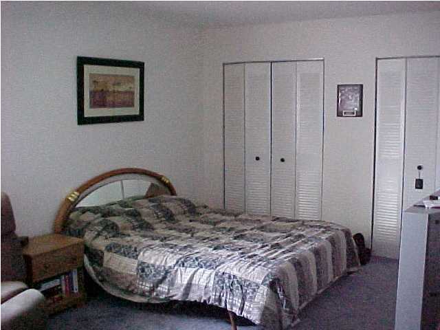 101 Old Ferry Road, Unit 18C Shalimar, FL 32579 - Photo 9 of 9 a bedroom with a bed and a cabinets