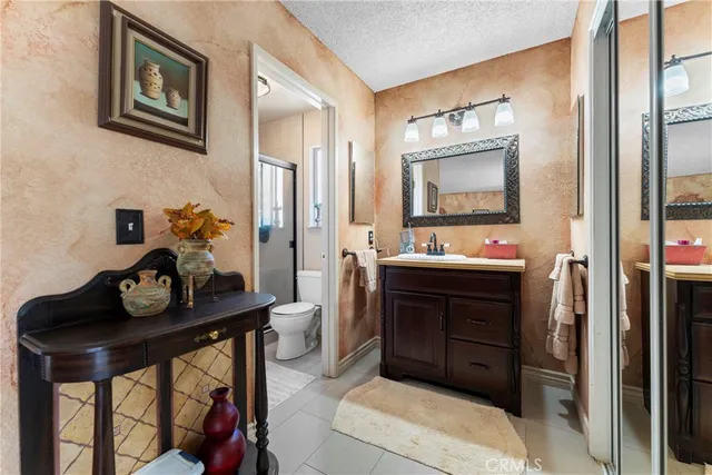 a bedroom with furniture and a book shelf