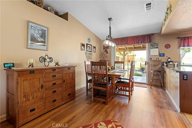 a view of a workspace with furniture window and wooden floor