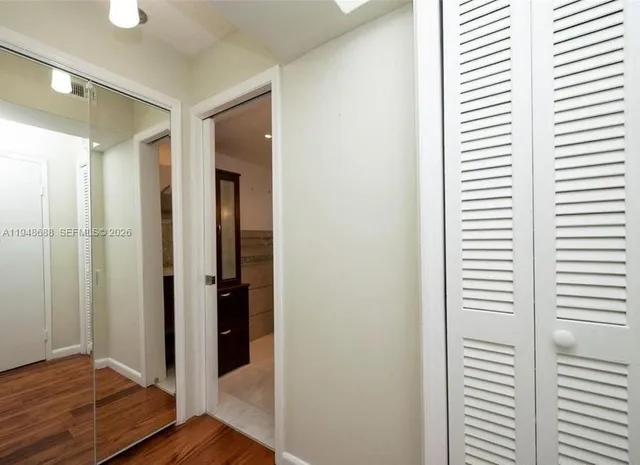 a view of a bathroom with wooden floor