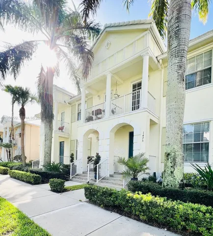 a couple of potted plants in front of a building
