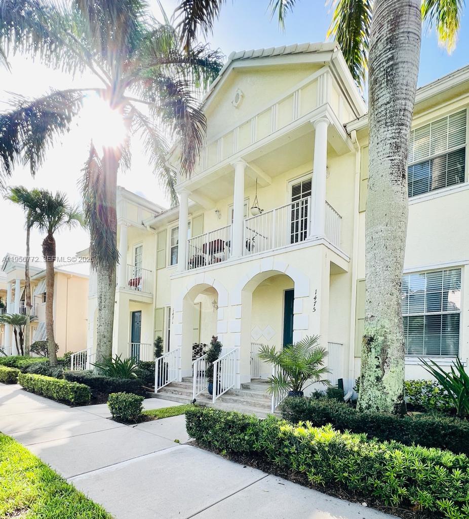 a couple of potted plants in front of a building