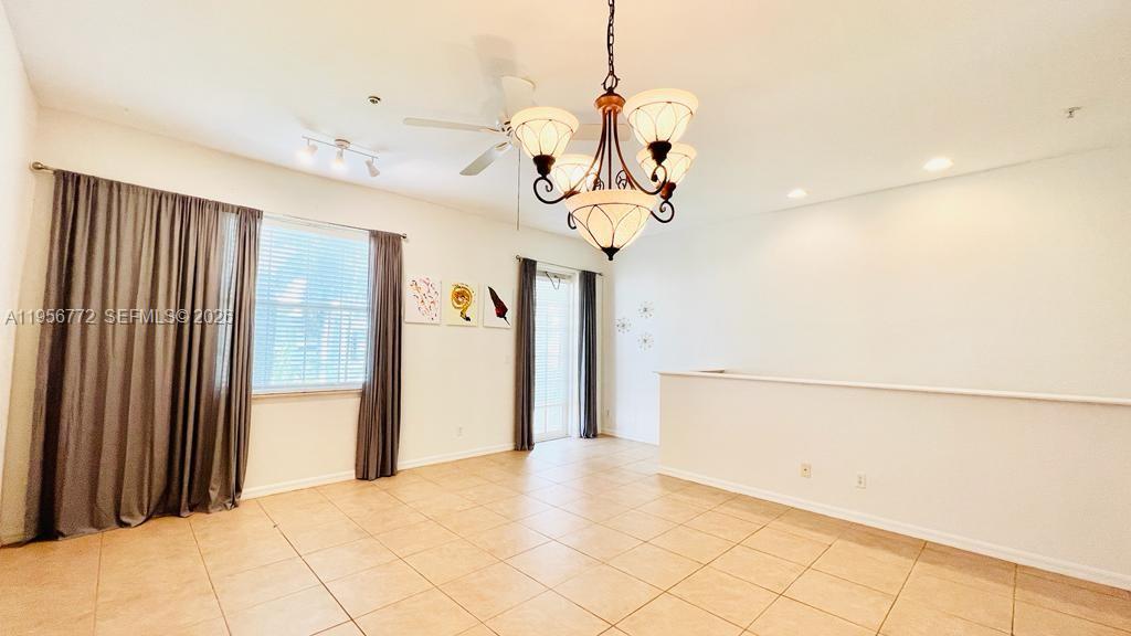 1475 Scilly Cay Lane, Unit 1475 Jupiter, FL 33458 - Photo 15 of 29 a view of a chandelier fan and refrigerator