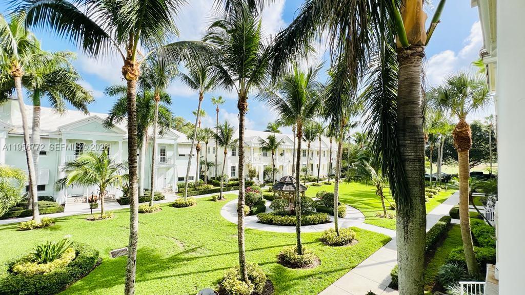 1475 Scilly Cay Lane, Unit 1475 Jupiter, FL 33458 - Photo 18 of 29 a view of a swimming pool with a garden