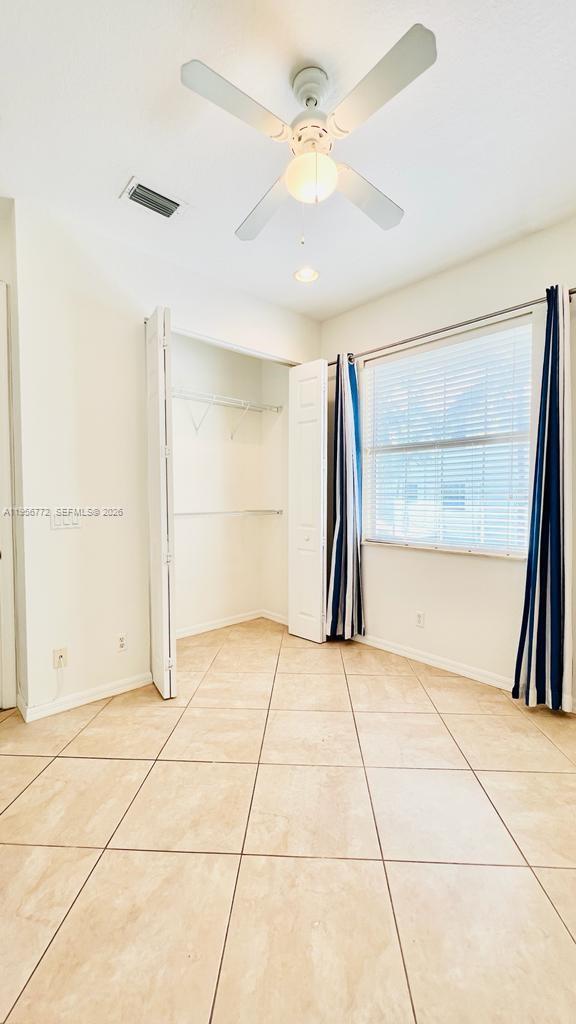 1475 Scilly Cay Lane, Unit 1475 Jupiter, FL 33458 - Photo 25 of 29 a view of an empty room with a window
