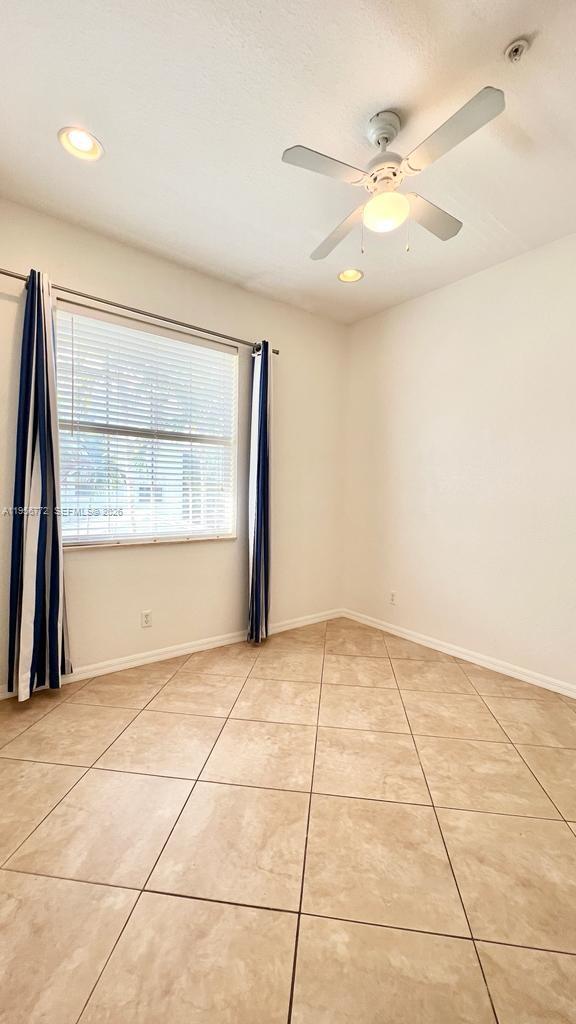 1475 Scilly Cay Lane, Unit 1475 Jupiter, FL 33458 - Photo 26 of 29 a view of an empty room with a window