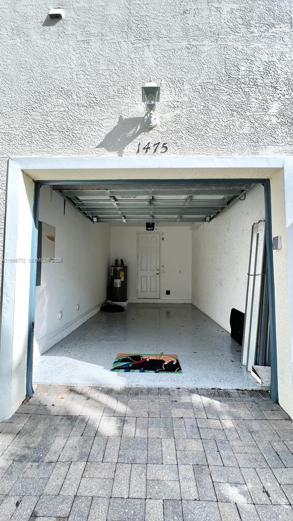 1475 Scilly Cay Lane, Unit 1475 Jupiter, FL 33458 - Photo 29 of 29 a view of a refrigerator in the kitchen