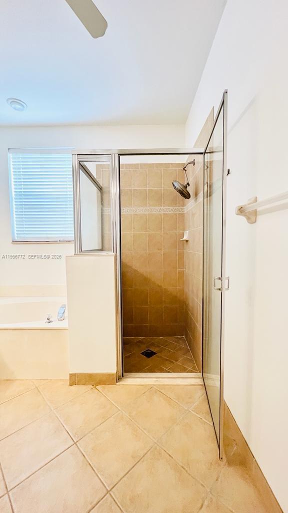 1475 Scilly Cay Lane, Unit 1475 Jupiter, FL 33458 - Photo 9 of 29 a bathroom with a shower and a sink