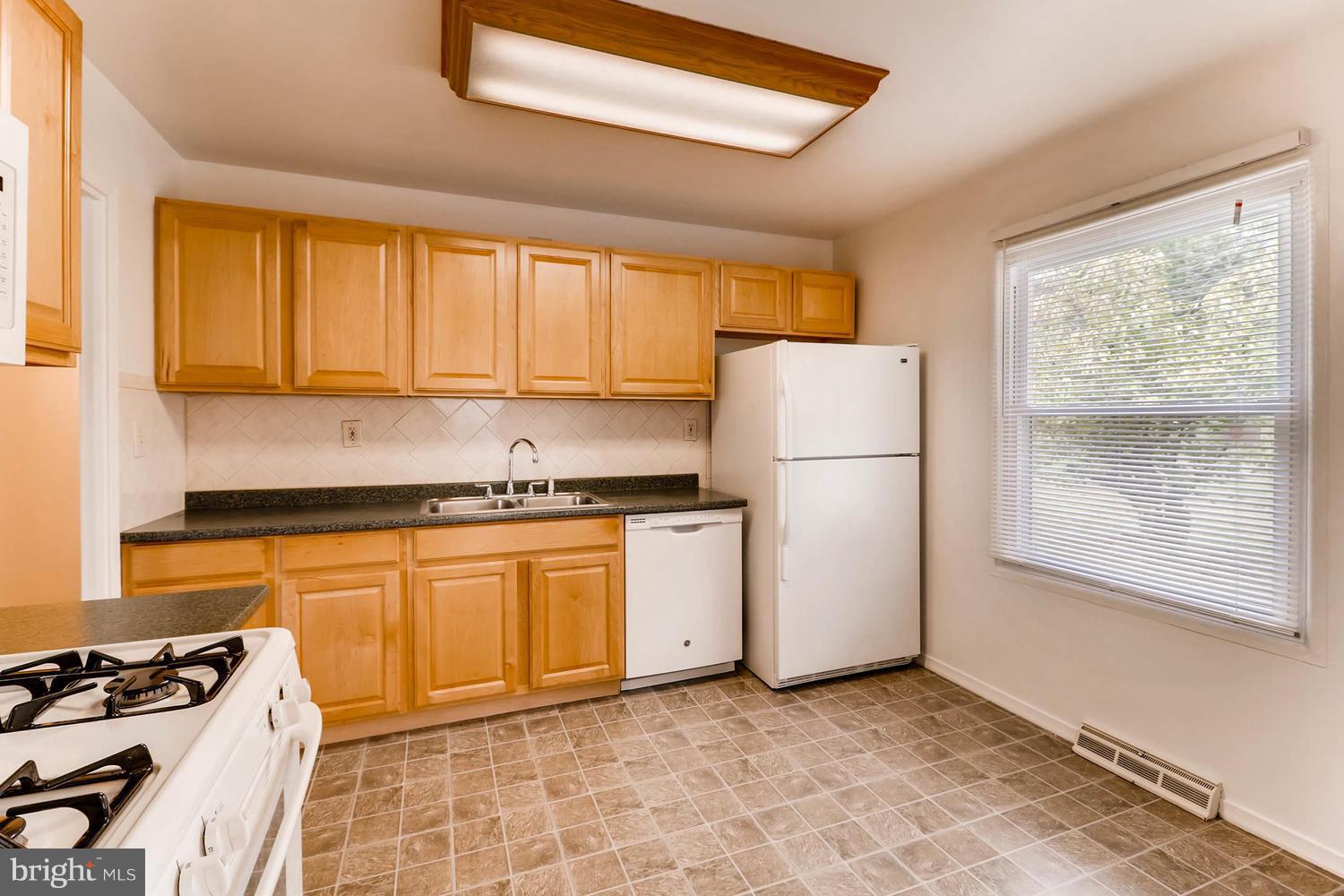 2008 Hanson Road Edgewood, MD 21040 - Photo 15 of 28 a kitchen with stainless steel appliances granite countertop a refrigerator sink and stove
