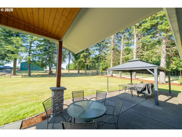 a view of swimming pool with outdoor seating space
