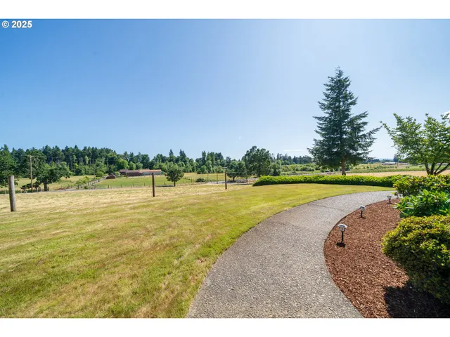 a view of a lake with houses in the background