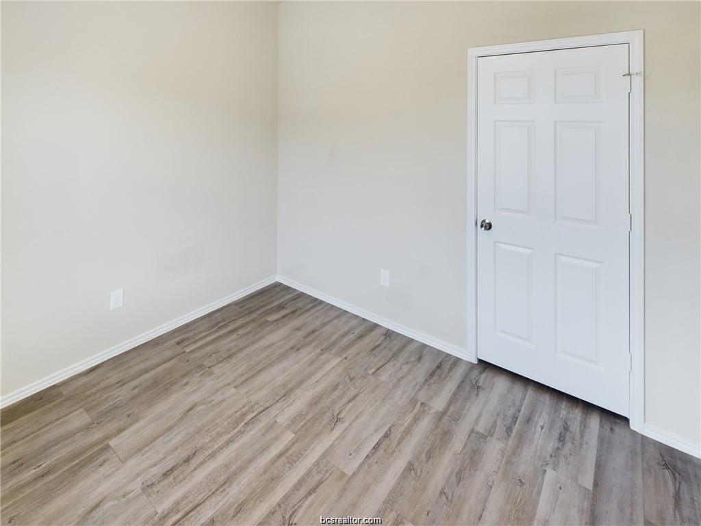 2910 Town Square Avenue, Unit 2604 Bryan, TX 77802 - Photo 8 of 8 a view of wooden floor in an empty room