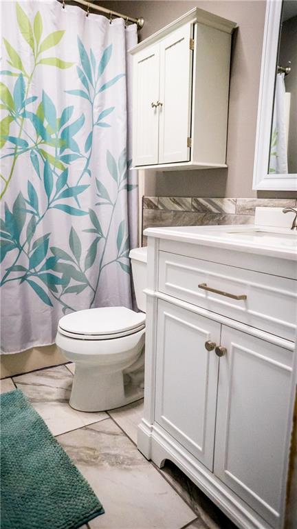 450 Leslie Road Valencia, PA 16059 - Photo 11 of 25 The hall bath on the upper level has been thoroughly remodeled and has tiled floor and overhead lighting which includes sound.