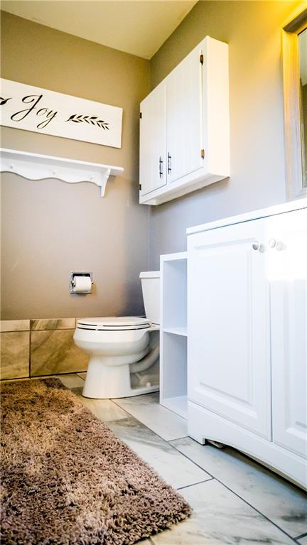 450 Leslie Road Valencia, PA 16059 - Photo 13 of 25 The master bedroom also has a recently renovated en suite half bath.