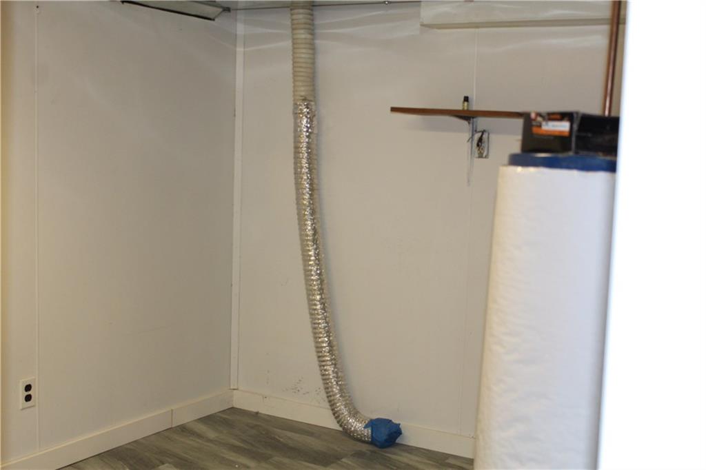 450 Leslie Road Valencia, PA 16059 - Photo 20 of 25 The laundry room is on the ground floor and has additional storage capacity.