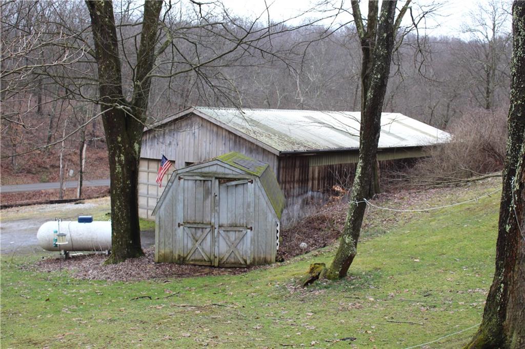 450 Leslie Road Valencia, PA 16059 - Photo 22 of 25 The barn has overhead doors. A shed provides additional storage space.
