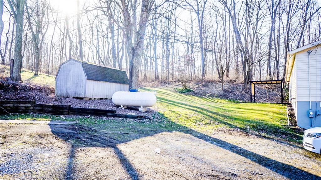 450 Leslie Road Valencia, PA 16059 - Photo 24 of 25 While there is no garage there is an ample parking area.