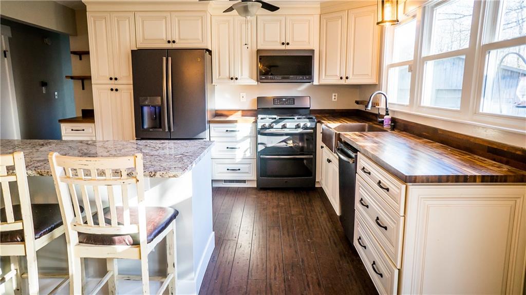 450 Leslie Road Valencia, PA 16059 - Photo 5 of 25 All the slate-finished appliances were updated within the last two years.