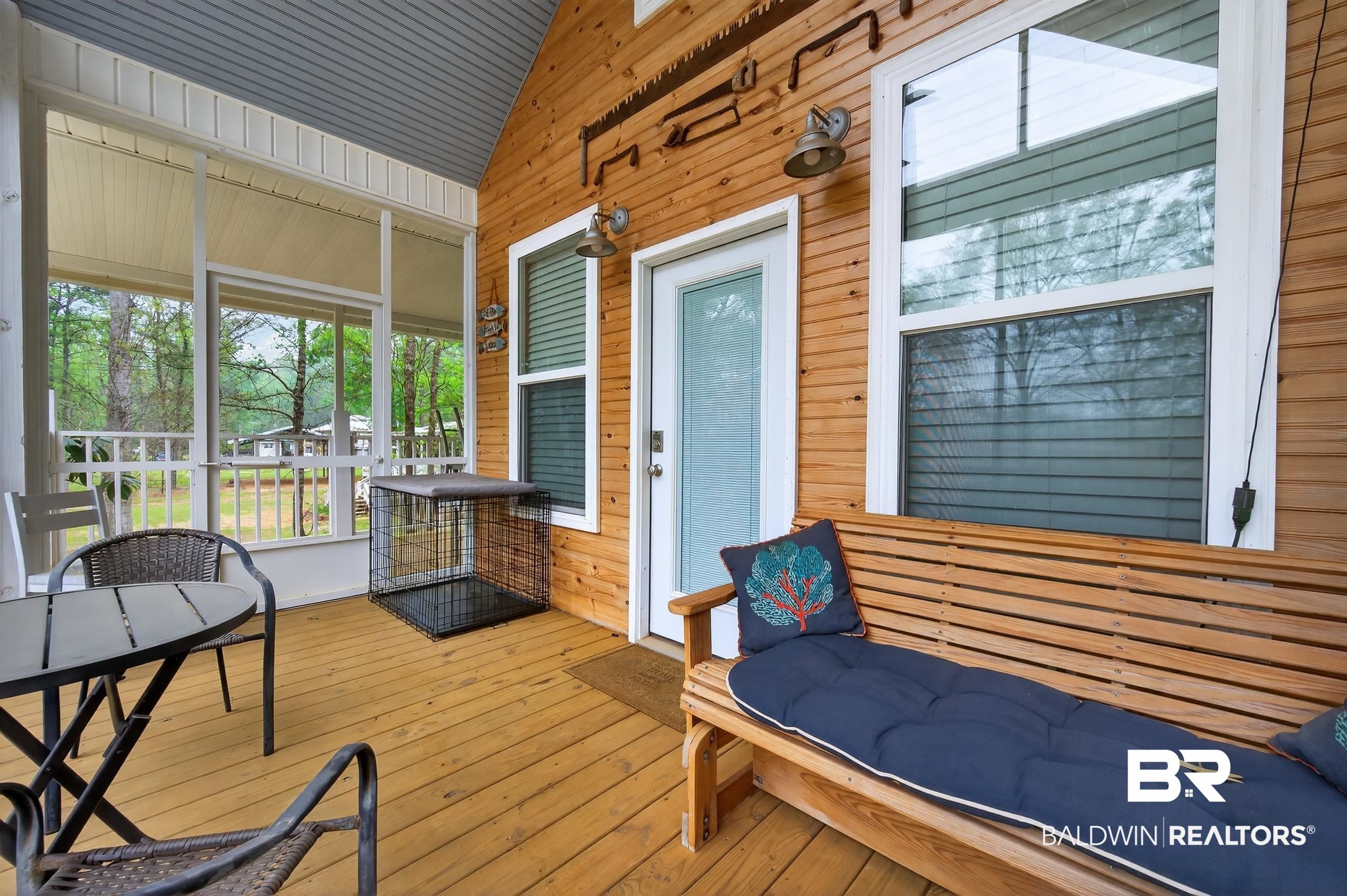 3983 Eureka Landing Road Uriah, AL 36480 - Photo 33 of 45 Sunroom / solarium with lofted ceiling and a wooden deck