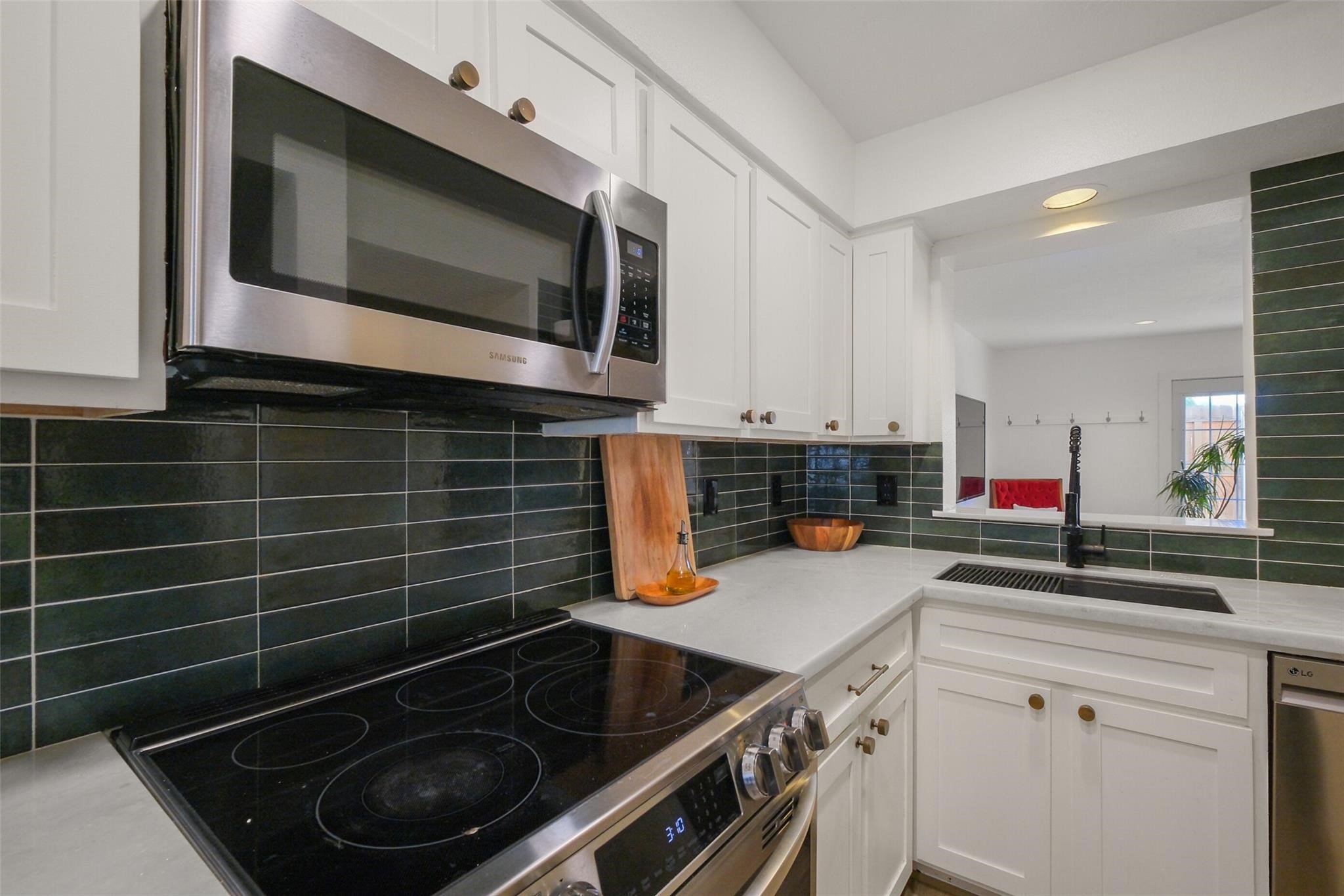 a kitchen with a stove and a microwave