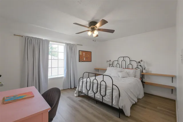 a bedroom with a bed and window