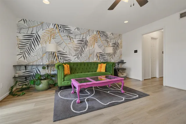 wooden floor with a table and chairs