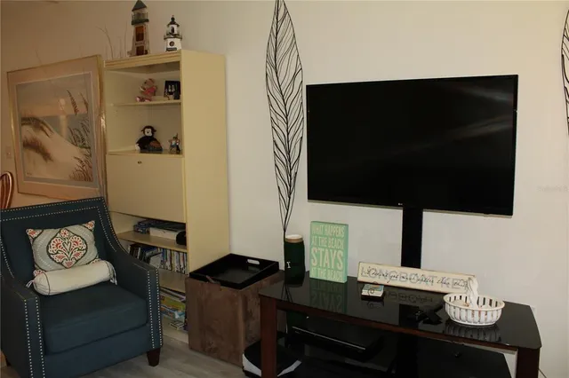 a view of a livingroom with furniture and a chandelier