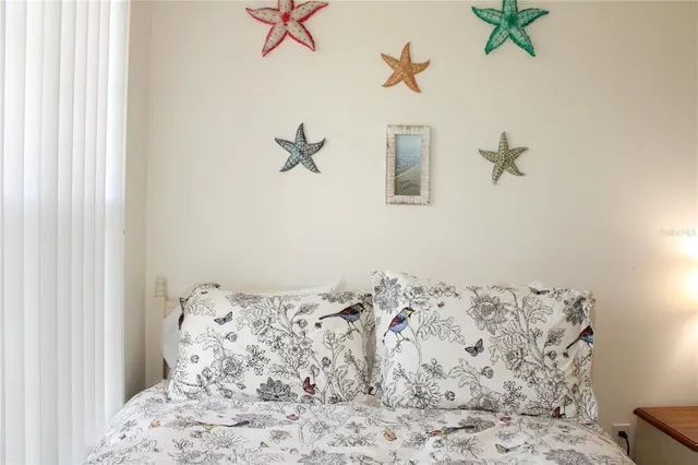 a bedroom with a bed and a mirror