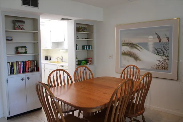 a view of a hallway with seating area